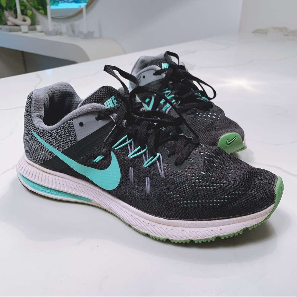 Nike teal and black tennis shoes.